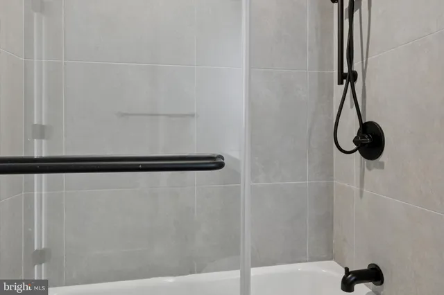 a bathroom with a sink toilet and mirror