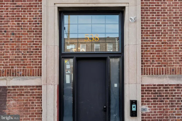 a view of a balcony with wooden floor