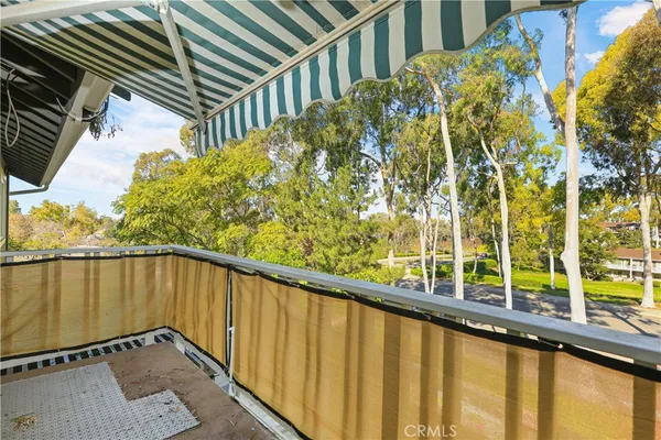 a view of balcony with wooden floor