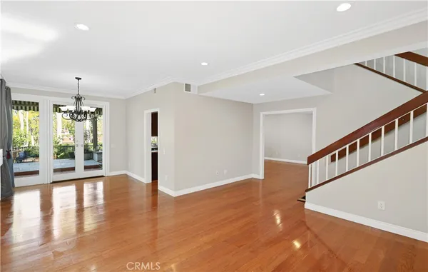a view of an entryway with wooden floor