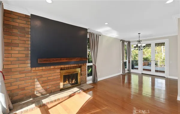 a living room with fireplace furniture and a flat screen tv