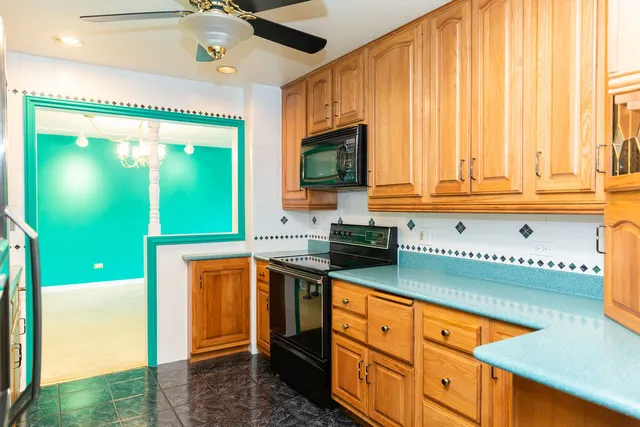a view of a hallway with a door and wooden floor