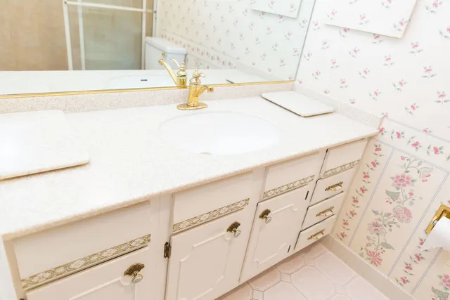 a bathroom with a shower curtain and a sink