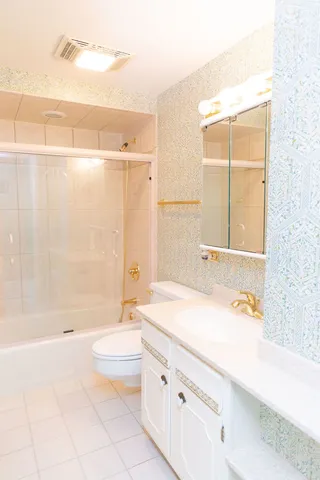 a bathroom with a shower and a bath tub