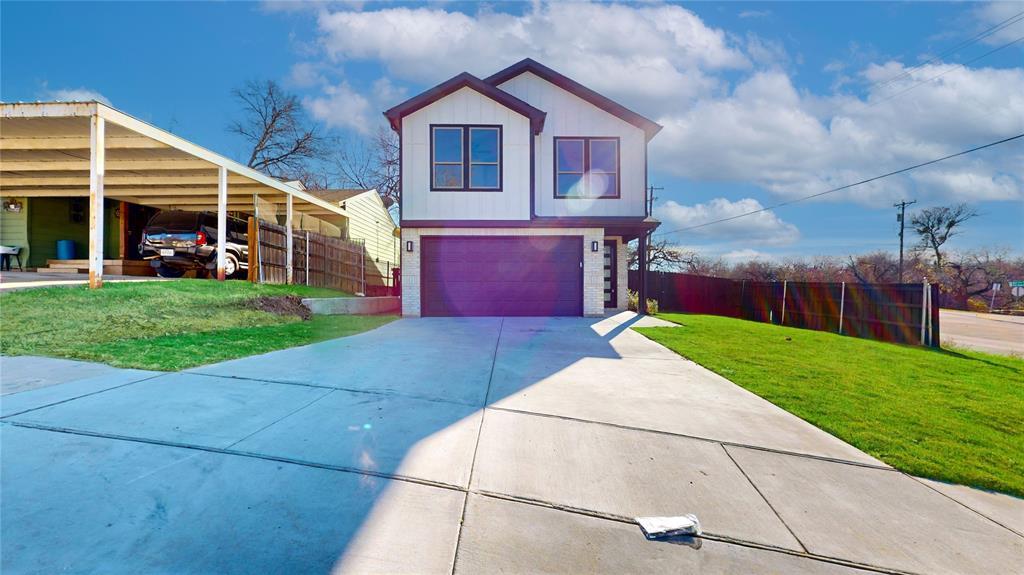 801 Birch Street Grand Prairie, TX 75050 - Photo 1 of 28 a front view of a house with a yard and garage