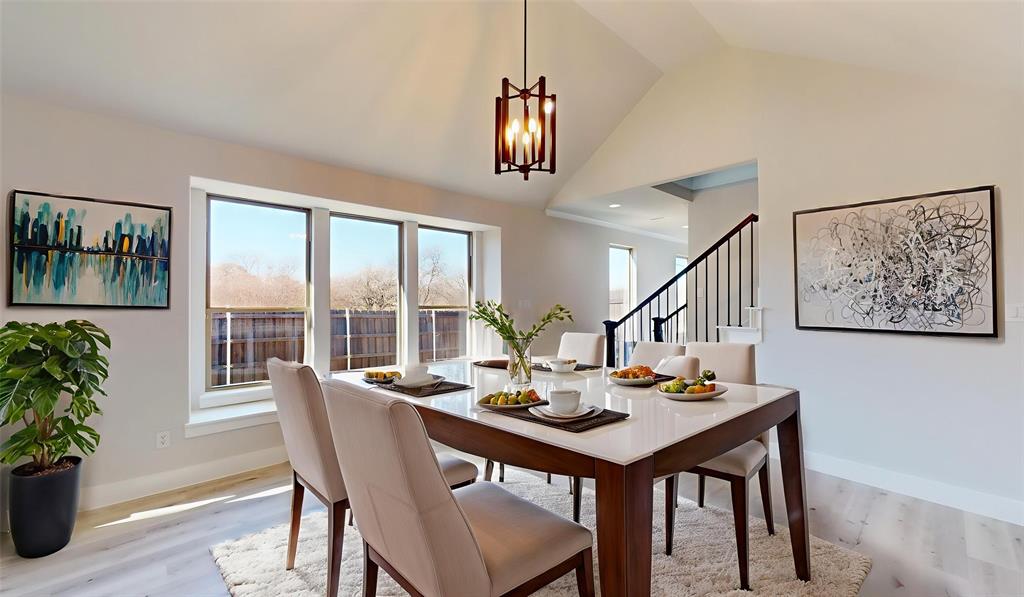 801 Birch Street Grand Prairie, TX 75050 - Photo 11 of 28 a view of a dining room with furniture window and wooden floor