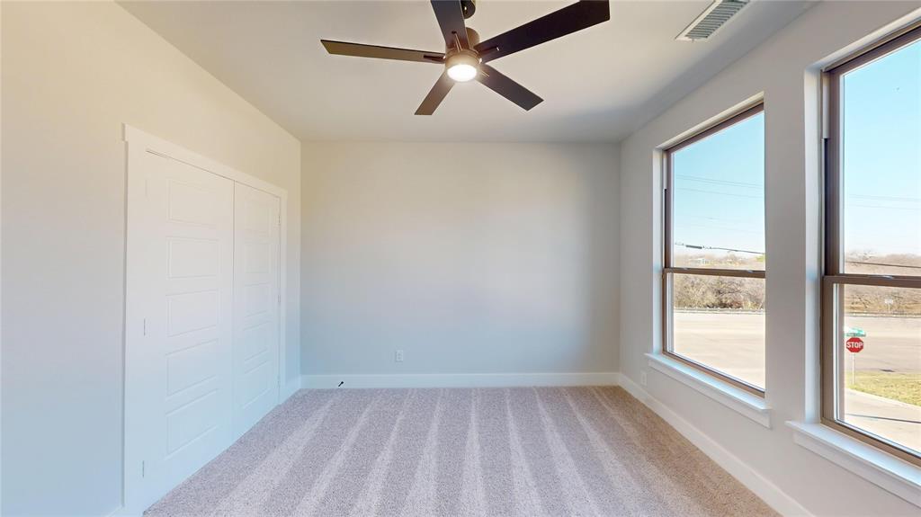 801 Birch Street Grand Prairie, TX 75050 - Photo 22 of 28 a view of room with window and ceiling fan