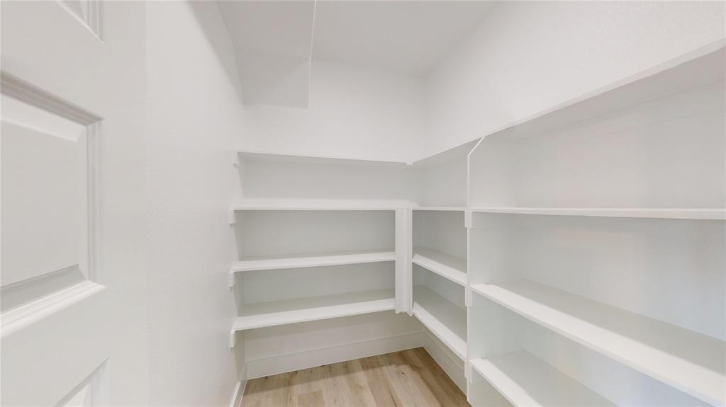 801 Birch Street Grand Prairie, TX 75050 - Photo 24 of 28 a view of a room with shelf