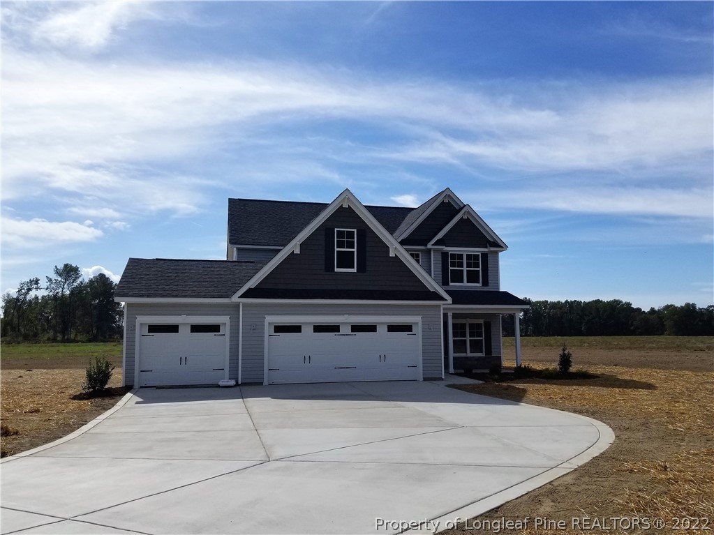 5224-lot7 J T Matthews Road Godwin, NC 28344 - Photo 1 of 42 a front view of a house with a yard