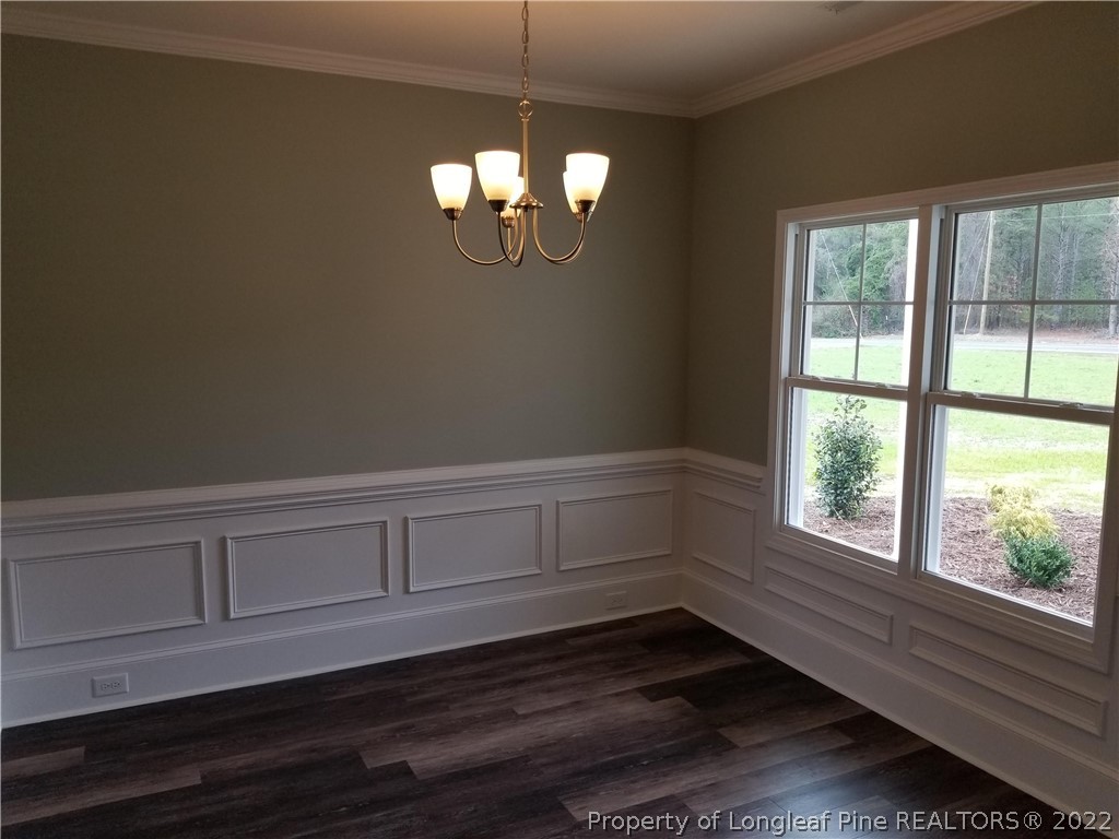 5224-lot7 J T Matthews Road Godwin, NC 28344 - Photo 11 of 42 a view of an empty room with wooden floor and a window