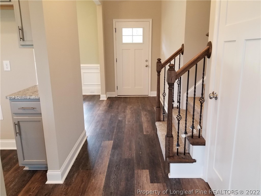 5224-lot7 J T Matthews Road Godwin, NC 28344 - Photo 20 of 42 a view of a hallway with wooden floor and stairs