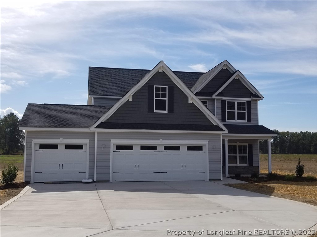 5224-lot7 J T Matthews Road Godwin, NC 28344 - Photo 2 of 42 a front view of a house with a garage
