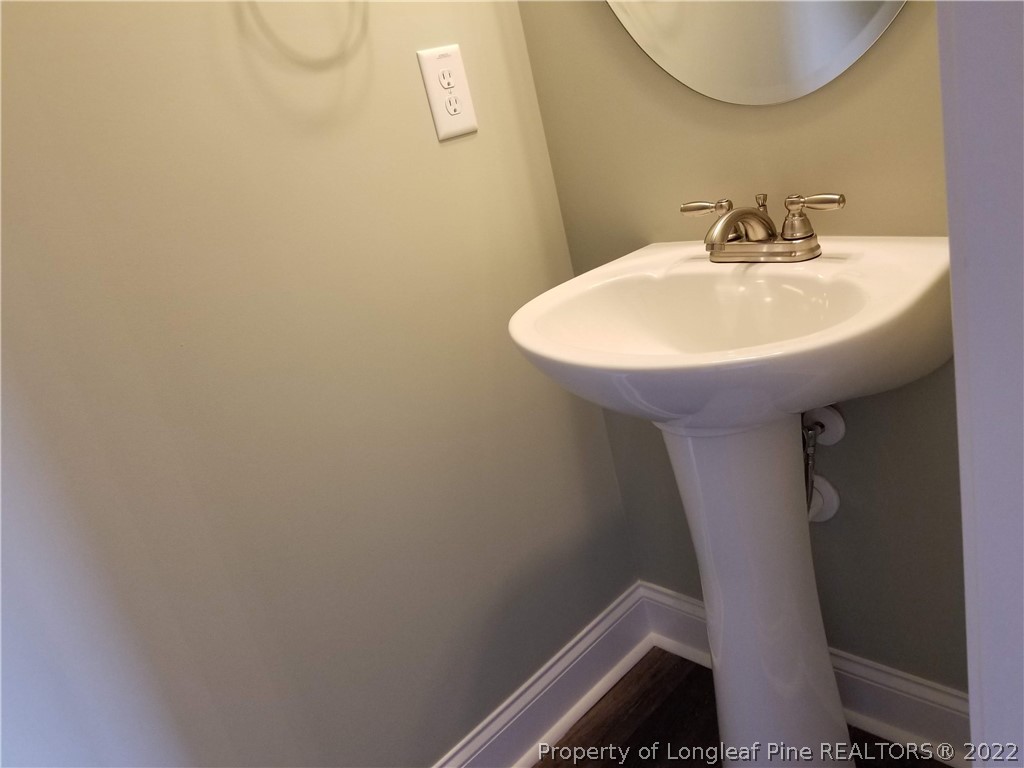 5224-lot7 J T Matthews Road Godwin, NC 28344 - Photo 21 of 42 a bathroom with a sink and mirror