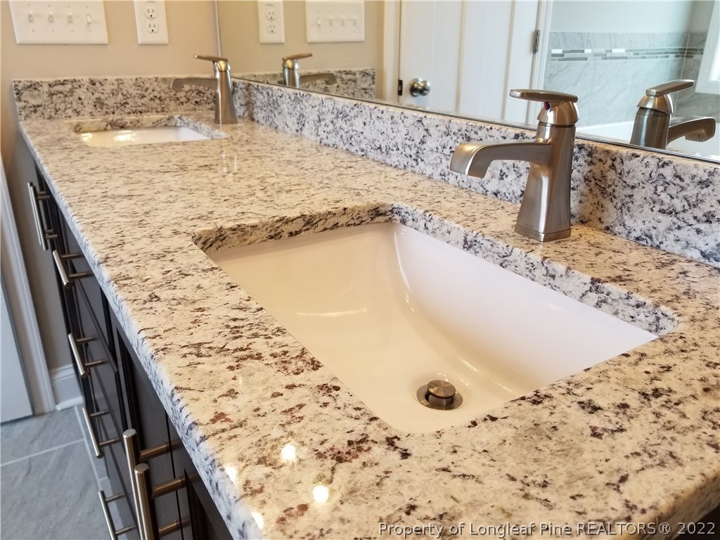 5224-lot7 J T Matthews Road Godwin, NC 28344 - Photo 26 of 42 a bathroom with a granite countertop sink and a tub