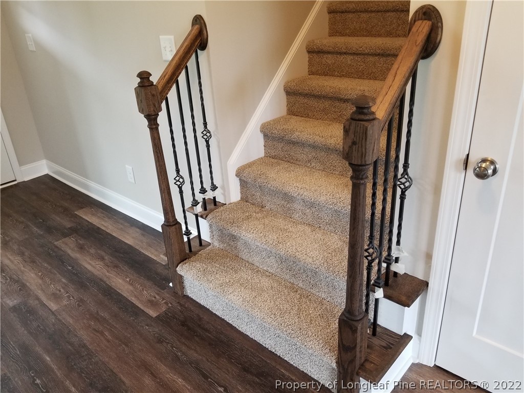 5224-lot7 J T Matthews Road Godwin, NC 28344 - Photo 28 of 42 a view of staircase with white walls and railing