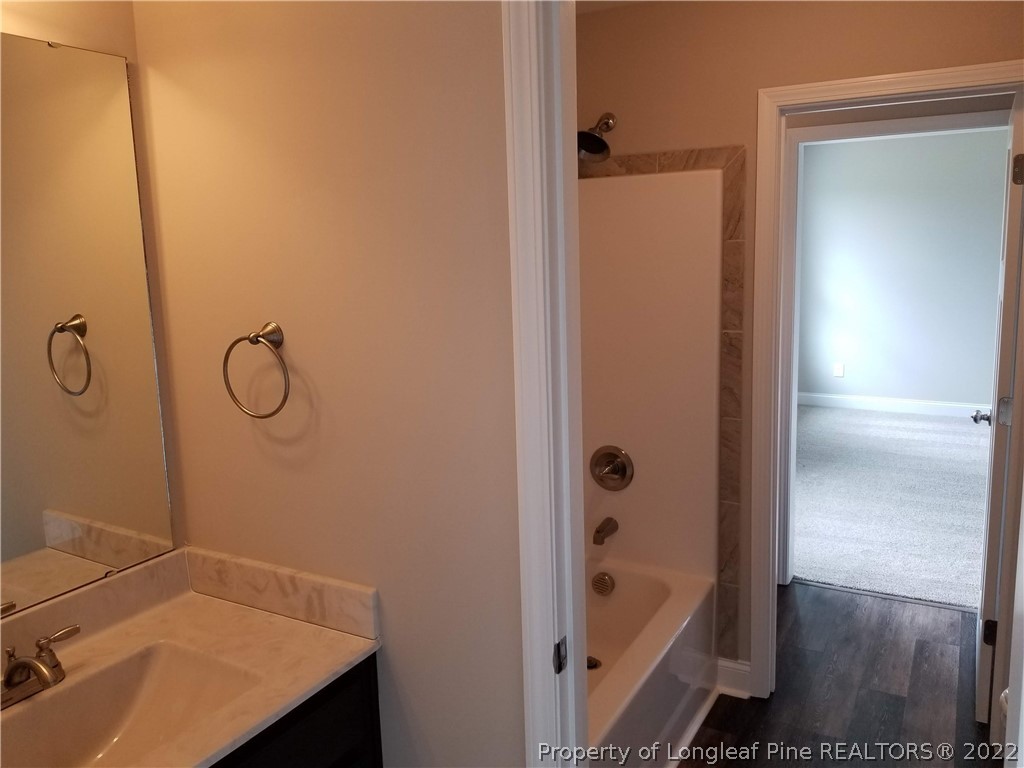 5224-lot7 J T Matthews Road Godwin, NC 28344 - Photo 35 of 42 a bathroom with a tub sink and vanity