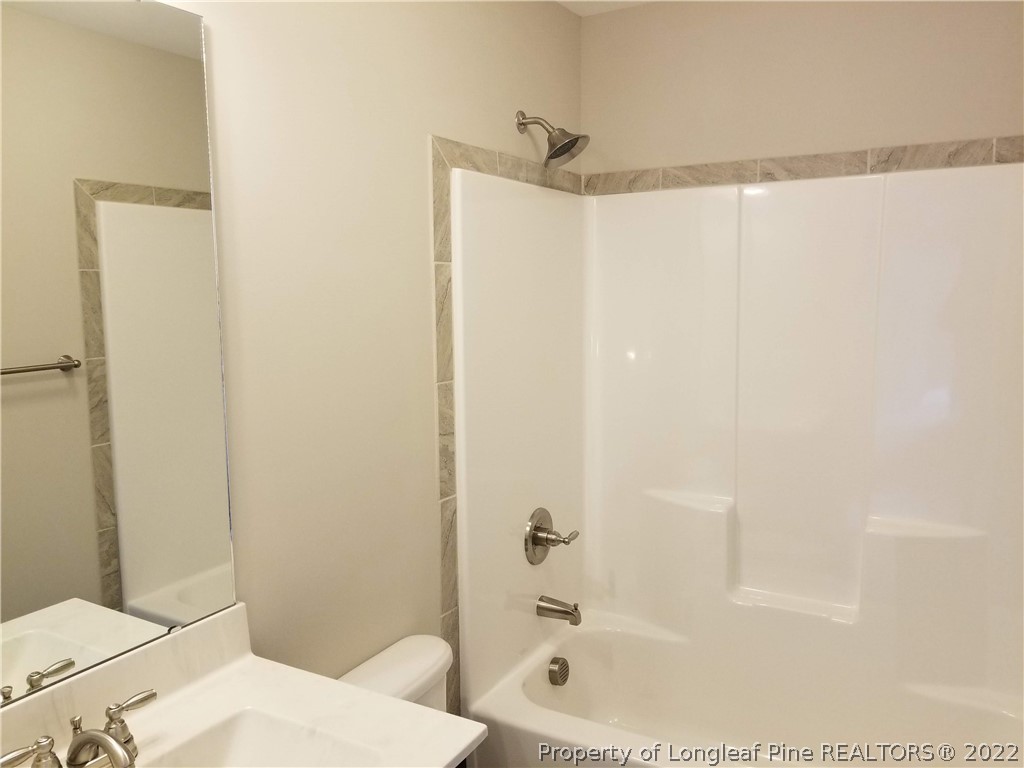 5224-lot7 J T Matthews Road Godwin, NC 28344 - Photo 37 of 42 a bathroom with a bathtub and a shower