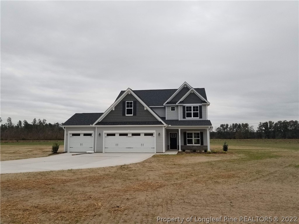 5224-lot7 J T Matthews Road Godwin, NC 28344 - Photo 4 of 42 a view of a big house with a yard and fence