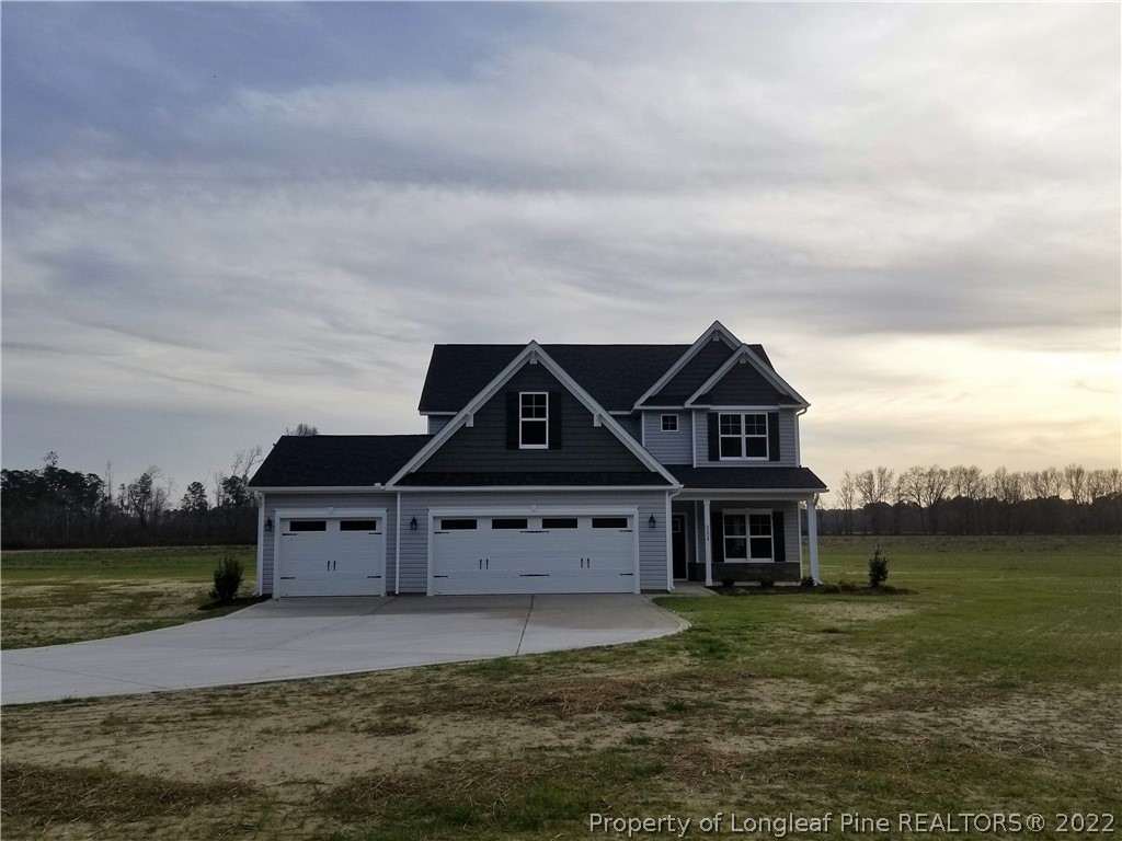5224-lot7 J T Matthews Road Godwin, NC 28344 - Photo 6 of 42 a front view of a house with a yard