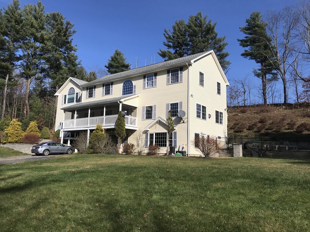 24 Fitzgerald Road Charlton, MA 01507 - Photo 2 of 42 a front view of house with yard