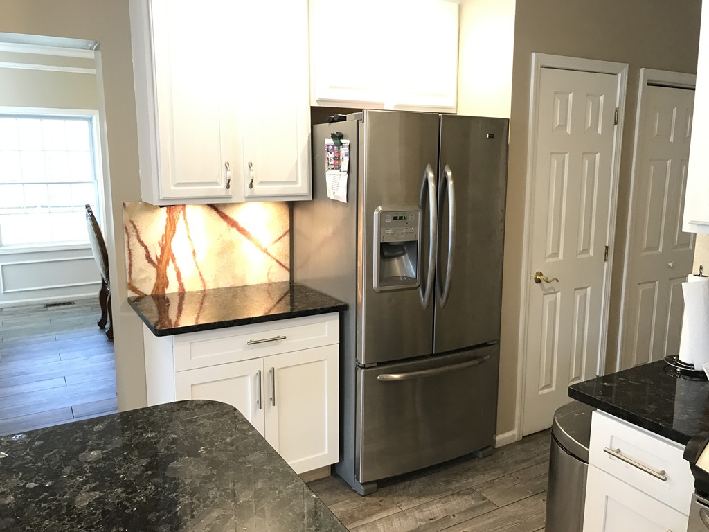 24 Fitzgerald Road Charlton, MA 01507 - Photo 29 of 42 a kitchen with stainless steel appliances granite countertop a refrigerator and a stove