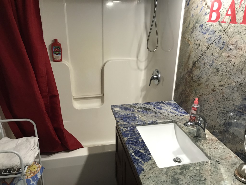 24 Fitzgerald Road Charlton, MA 01507 - Photo 35 of 42 a bathroom with a granite countertop sink a toilet and shower