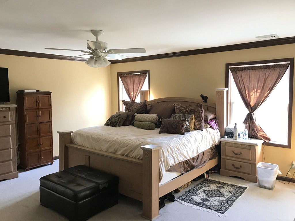 24 Fitzgerald Road Charlton, MA 01507 - Photo 38 of 42 a bedroom with a bed and wooden floor