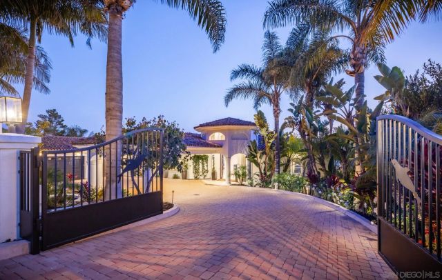 a view of a house with a yard and tree s