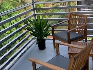 a view of a balcony with chairs