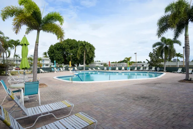 a view of a swimming pool and a yard