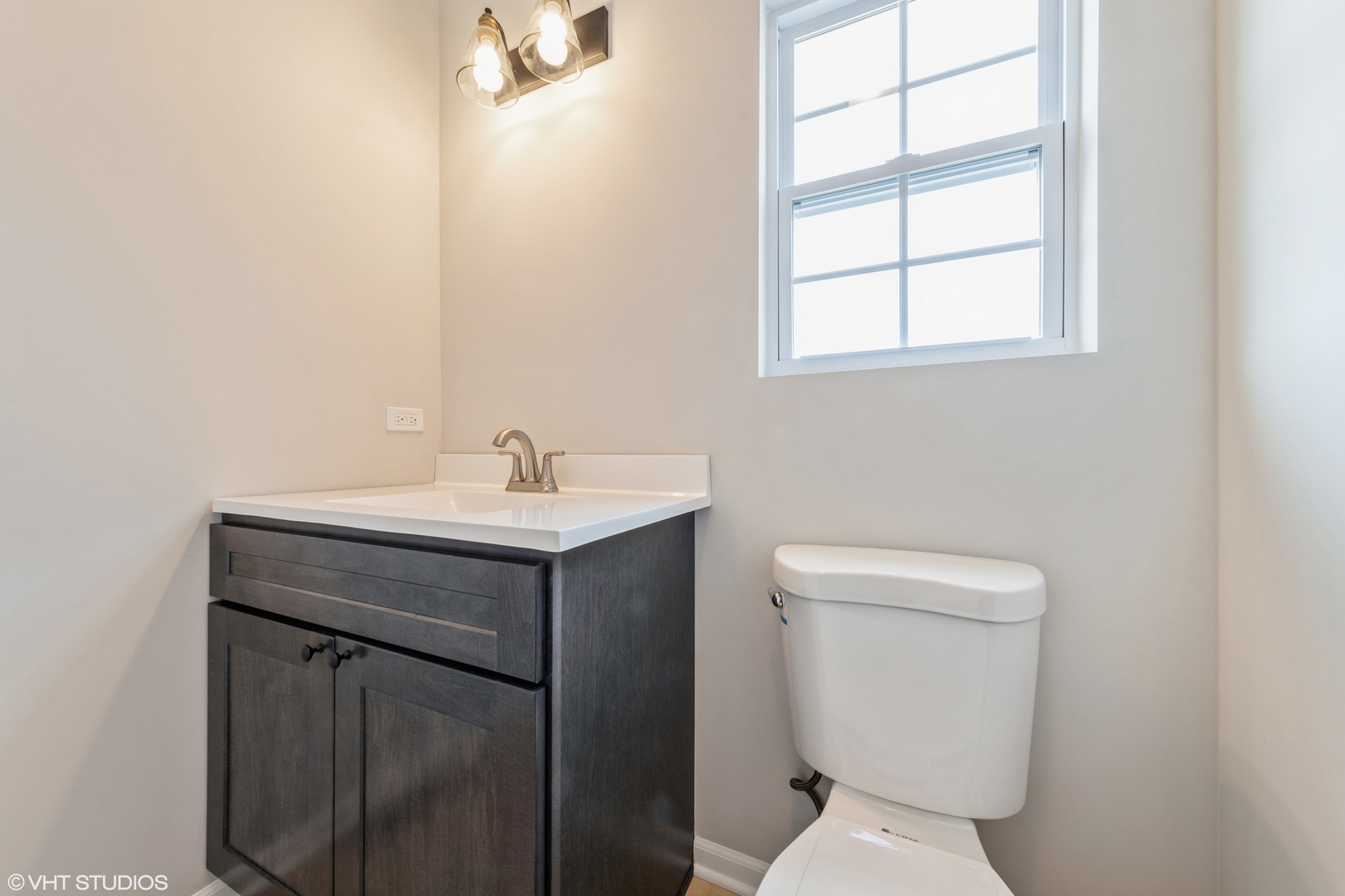 200 Crystal Lane Steger, IL 60475 - Photo 11 of 24 a bathroom with a toilet sink and mirror