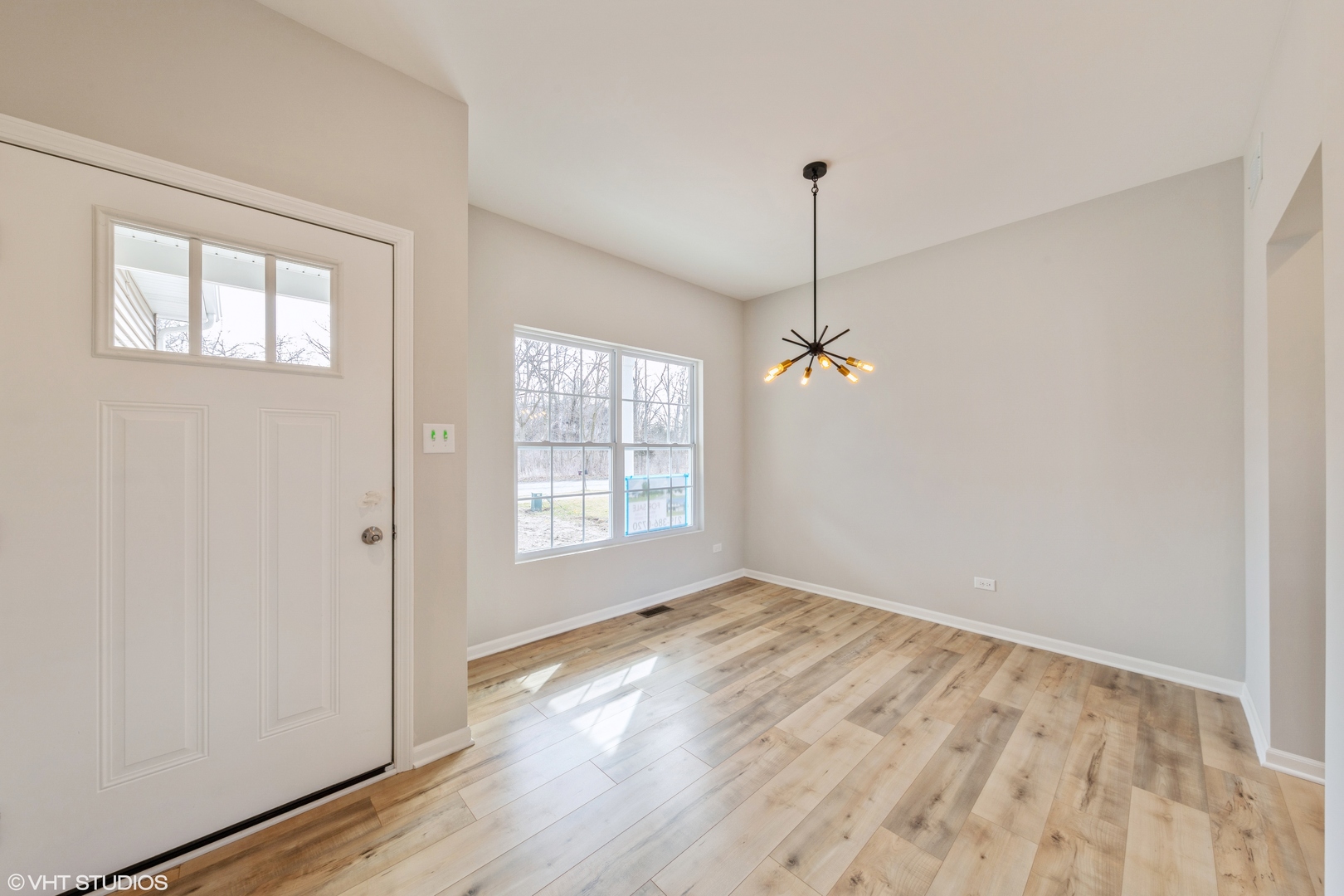 200 Crystal Lane Steger, IL 60475 - Photo 5 of 24 a view of an empty room with wooden floor and a window