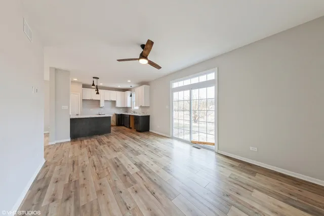 a view of kitchen with furniture and wooden floor