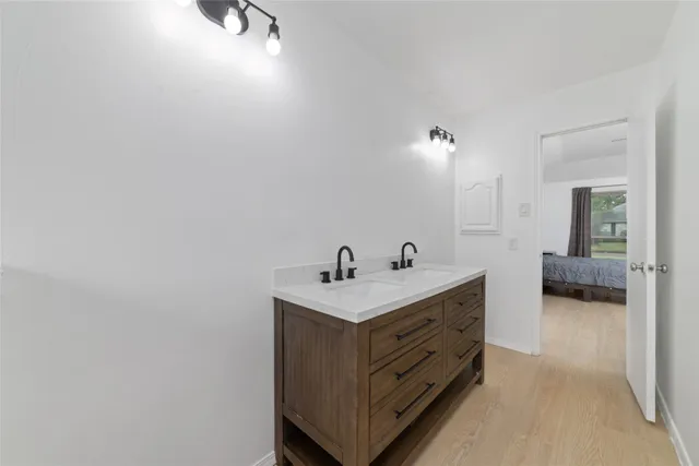 a en suite bathroom with a sink and a mirror
