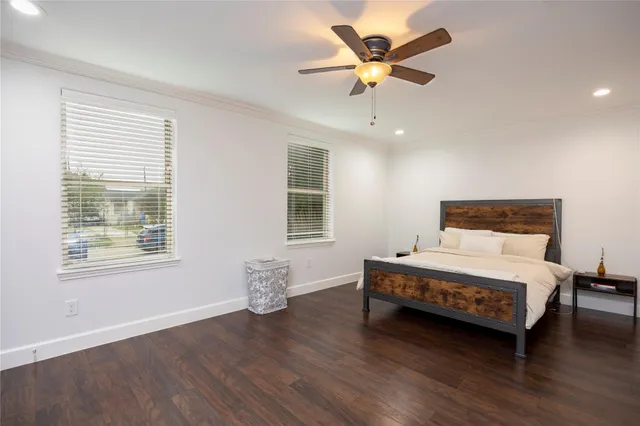 a spacious bedroom with a bed and a window