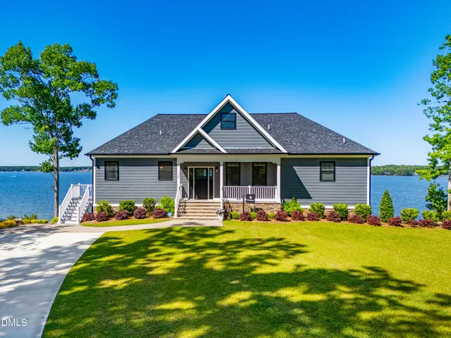 a very nice looking room with a large window and a mirror