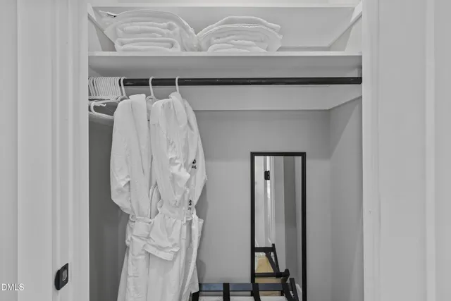 a view of a patio with table and chairs with wooden floor and plants