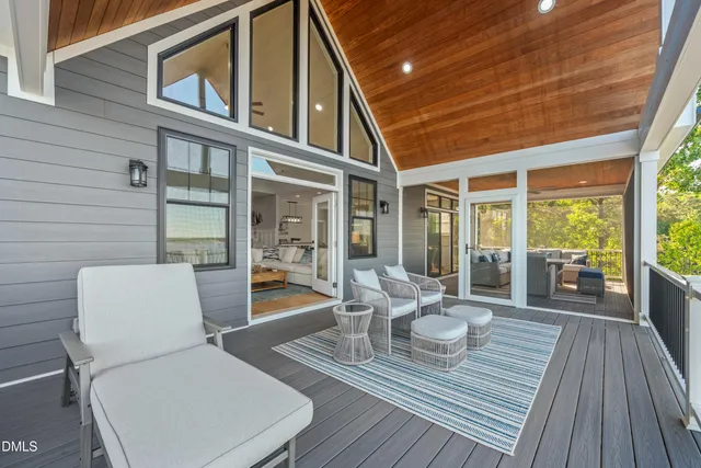a view of a swimming pool with a house in the background