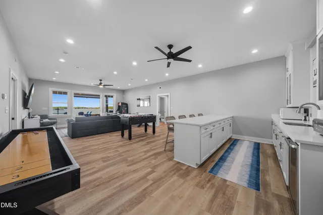 a view of balcony with couch and chairs