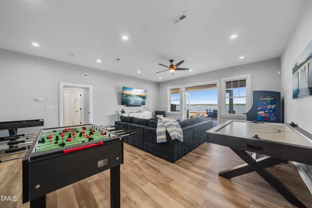 a view of a lake with lawn chairs