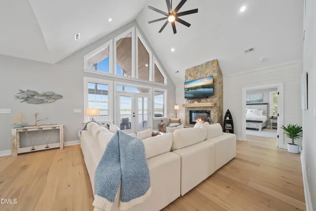 a dining area with a table chairs and kitchen view