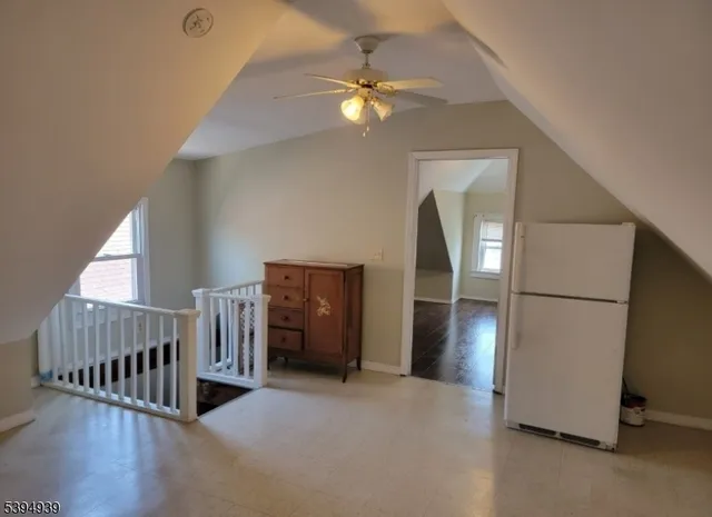 a view of livingroom with furniture and workspace
