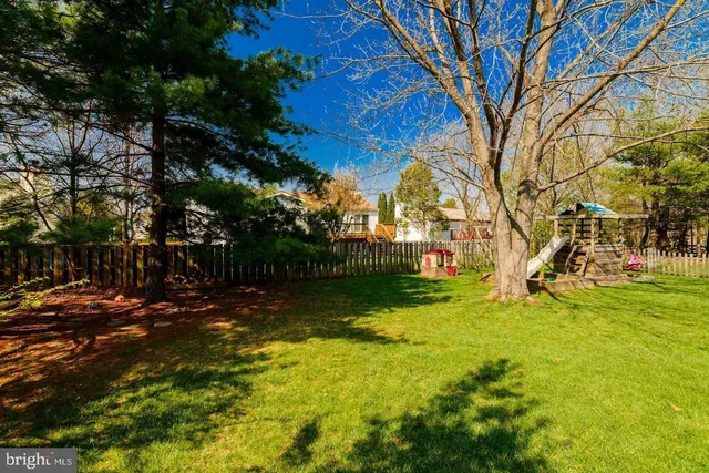 a view of a yard with swimming pool