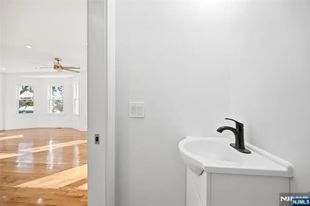a bathroom with a sink and vanity