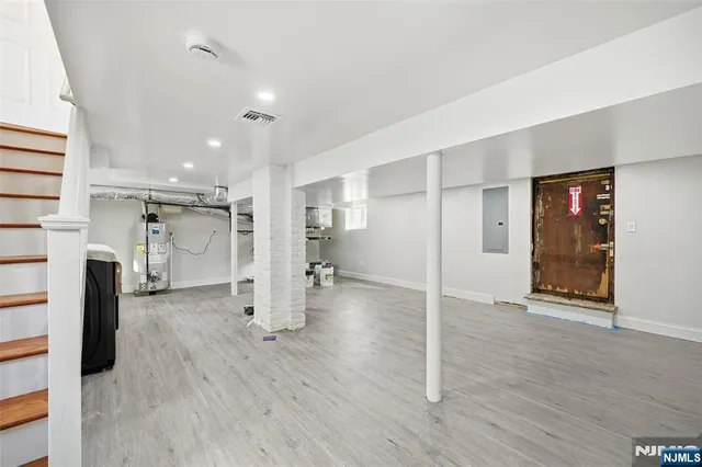 a view of a livingroom with furniture hardwood floor and a ceiling fan