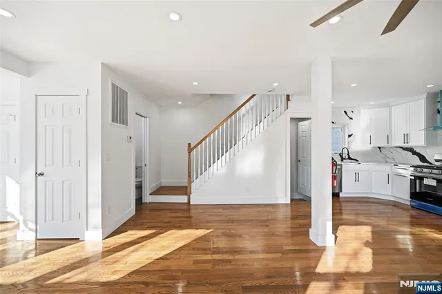 a view of a living room and entryway