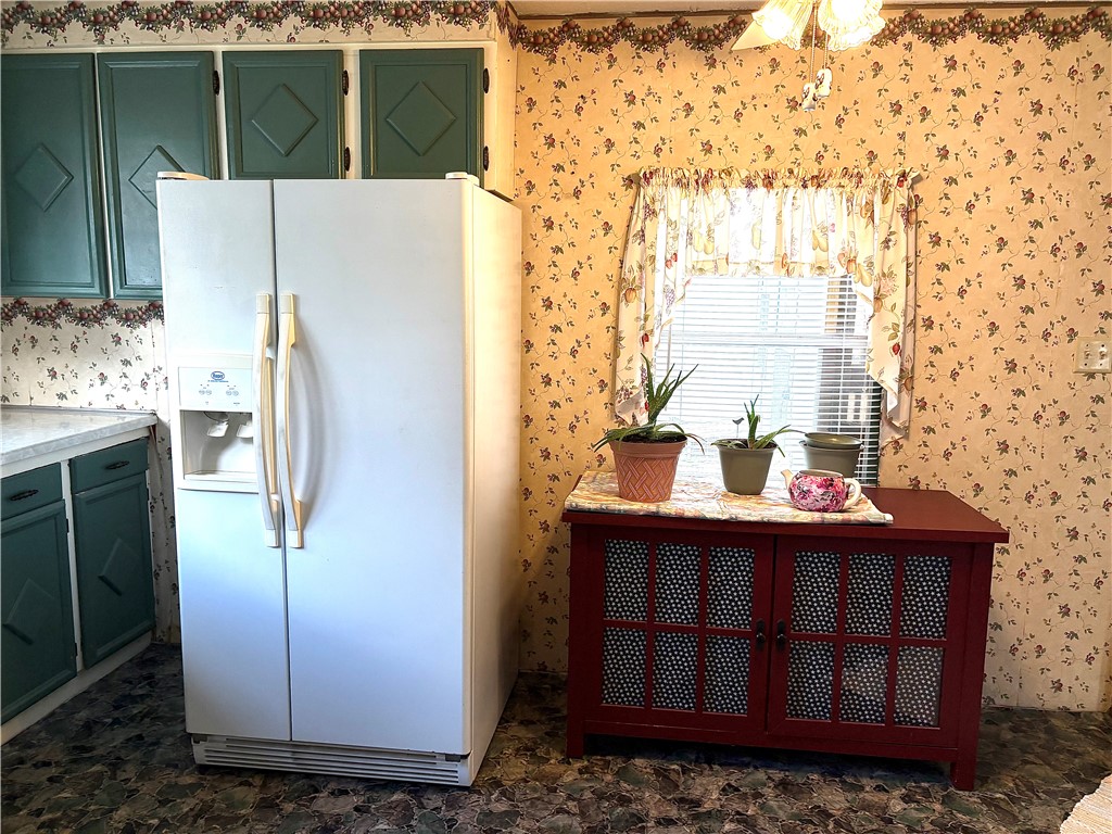 5434 North Waynesville Road, Unit 15 Oregonia, OH 45054 - Photo 14 of 19 This cozy kitchen features practical appliances and charming details.