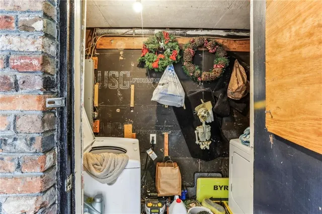 a view of a patio with a dining table and chairs with wooden fence