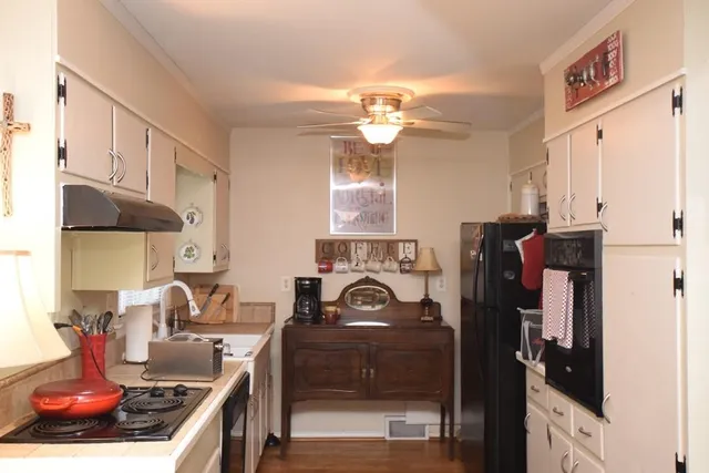a kitchen with stainless steel appliances granite countertop a stove and a sink