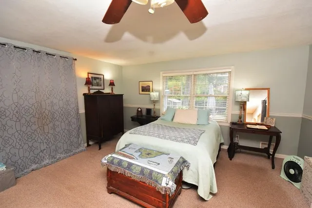a view of living room with furniture and a window